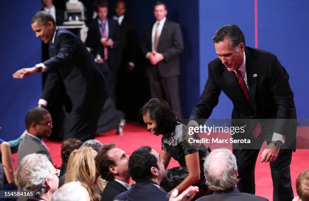 President Barack Obama , first lady Michelle Obama, and Republican presidential candidate Mitt Romney greet people after the debate at the Keith C....