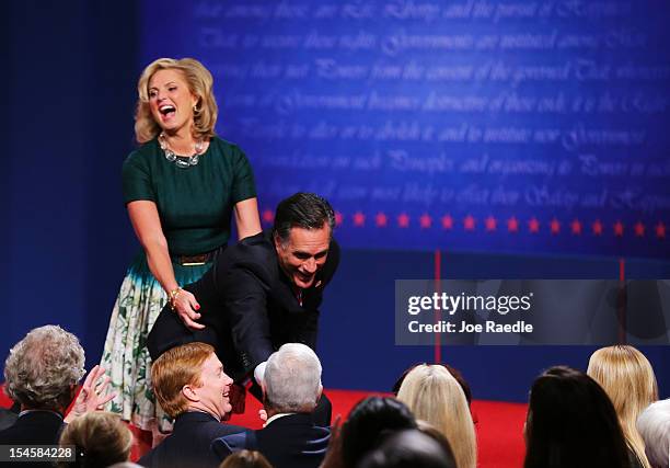 Republican presidential candidate Mitt Romney with wife, Ann Romney greet people on stage after the debate at the Keith C. And Elaine Johnson Wold...