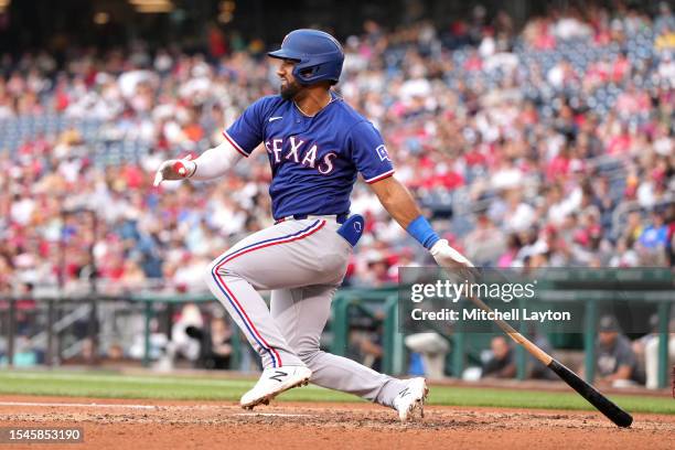 Ezequiel Duran of the Texas Rangers takes a swing during a baseball game against the Washington Nationals at Nationals Park on July 8, 2023 in...