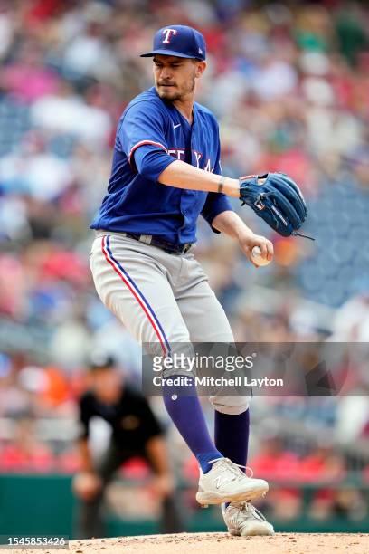 Andrew Heaney of the Texas Rangers pitches during a baseball game against the Washington Nationals at Nationals Park on July 8, 2023 in Washington,...