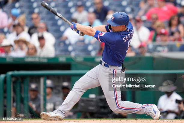 Corey Seager of the Texas Rangers takes a swing during a baseball game against the Washington Nationals at Nationals Park on July 8, 2023 in...