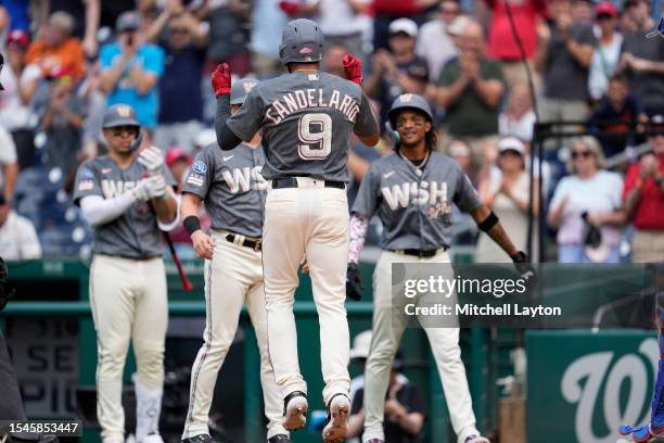 Jeimer Candelario of the Washington Nationals celebrates a home run during a baseball game against the Texas Rangers at Nationals Park on July 8,...