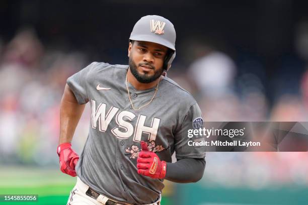 Jeimer Candelario of the Washington Nationals runs to third base during a baseball game against the Texas Rangers at Nationals Park on July 8, 2023...