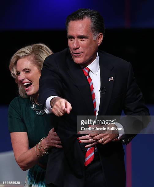 Ann Romney grabs her husband, Republican presidential candidate Mitt Romney, at the conclusion of a debate with U.S. President Barack Obama at the...