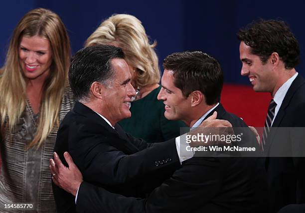 Republican presidential candidate Mitt Romney greets his son Matt Romney on stage after the debate at the Keith C. And Elaine Johnson Wold Performing...