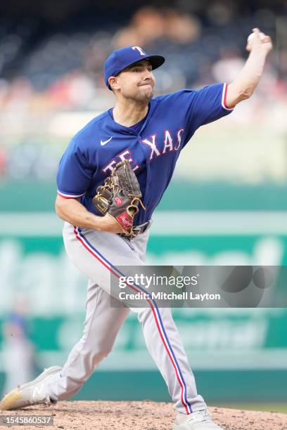 Brock Burke of the Texas Rangers pitches during a baseball game against the Washington Nationals at Nationals Park on July 8, 2023 in Washington, DC.