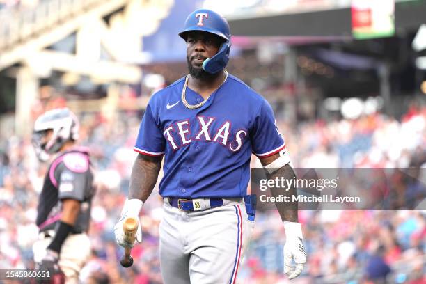 Adolis Garcia of the Texas Rangers walks back to the dug out during a baseball game against the Washington Nationals at Nationals Park on July 8,...