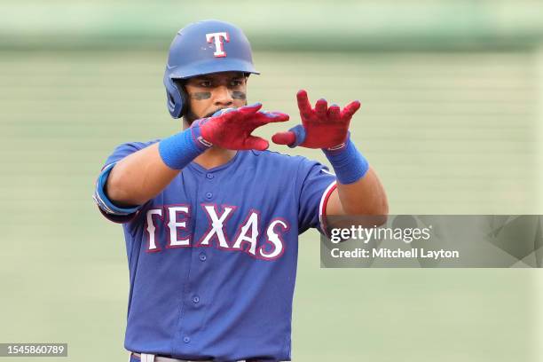 Leody Taveras of the Texas Rangers celebrates a double during a baseball game against the Washington Nationals at Nationals Park on July 8, 2023 in...