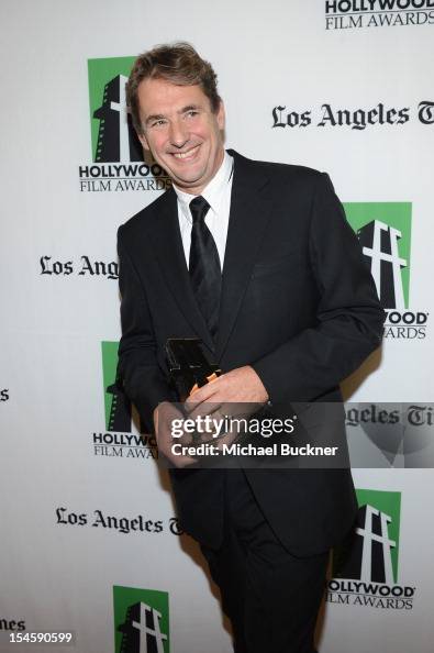 Honoree Tim Bevan poses with the Hollywood Producer Award backstage ...