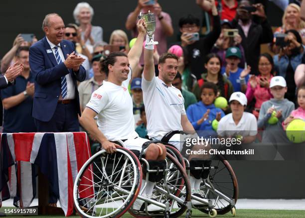 Gordon Reid and Alfie Hewitt of Great Britain lift the Men's Wheelchair Doubles Trophy following their victory in the Men's Wheelchair Doubles Final...