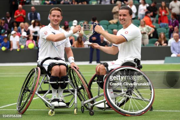 Alfie Hewitt and Gordon Reid of Great Britain lift the Men's Wheelchair Doubles Trophy following their victory in the Men's Wheelchair Doubles Final...