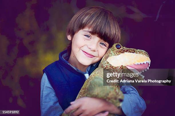 boy and his dinosaur - dinosaur toy i stock pictures, royalty-free photos & images