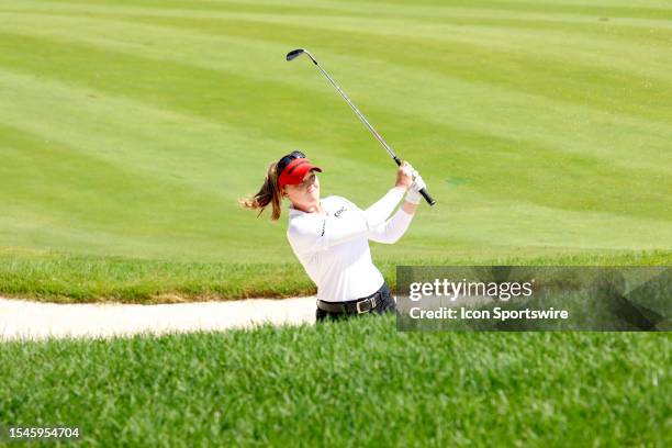 Golfer Brooke Henderson plays her second shot out of a fairway bunker on the 11th hole on July 20 during the second round of the Dow Great Lake Bay...