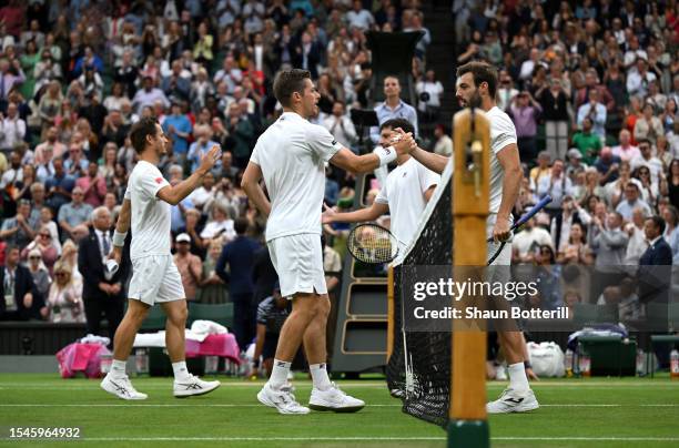 Wesley Koolhof of the Netherlands and Neal Skupski of Great Britain meet their opponents at the net following the Men's Doubles Finals against Marcel...