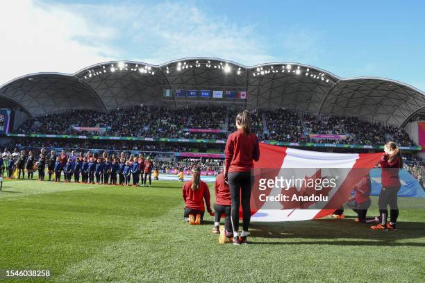 Players of Canada sing their national anthem ahead of the FIFA Women's World Cup Australia and New Zealand 2023 Group B match between Nigeria and...