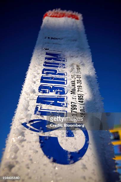 The OAO Gazprom logo sits on a sign near a natural gas well at the company's new Bovanenkovo deposit, near Bovanenkovskoye on the Yamal Peninsula in...