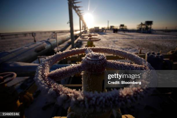 Ice sits on a valve control wheel connected to pipe work at OAO Gazprom's new Bovanenkovo deposit, a natural gas field near Bovanenkovskoye on the...
