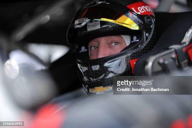 Kyle Busch, driver of the Lenovo Chevrolet, sits in his car during qualifying for the NASCAR Cup Series Crayon 301 at New Hampshire Motor Speedway on...