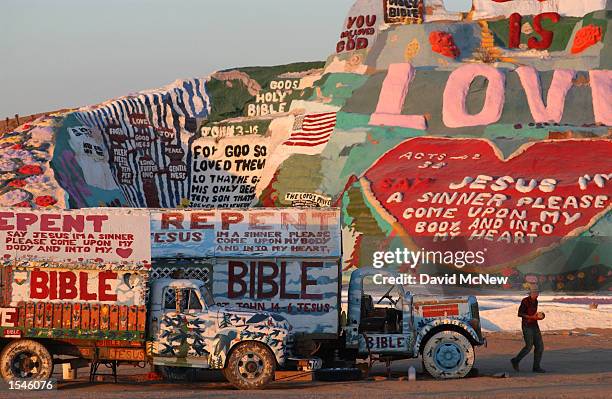 Leonard Knight walks from the truck that is his home and the one which is his transportation near Salvation Mountain, an expression of his love for...