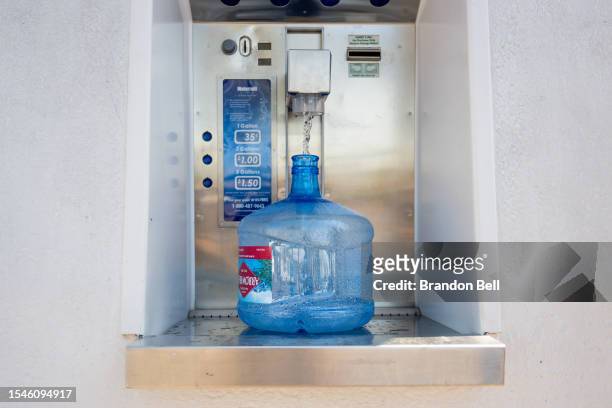 Person's water jug is being filled during a heat wave on July 15, 2023 in Phoenix, Arizona. Weather forecasts today are expecting temperatures to...