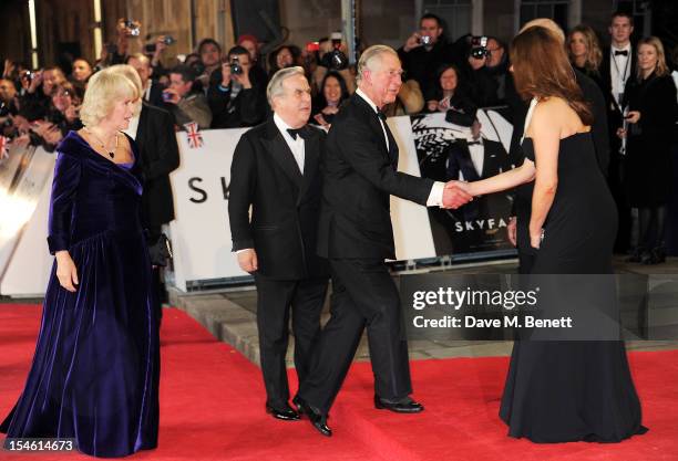 Camilla, Duchess of Cornwall and Prince Charles, Prince of Wales meet producers Michael G. Wilson and Barbara Broccoli at the Royal World Premiere of...