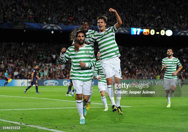 Giorgos Samaras of Celtic FC celebrates scoring with his teammates Mikael Lustig and Efe Ambrose during the UEFA Champions League group G match...
