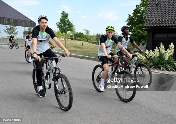 Marcelo Pitaluga, Bobby Clark and Ibrahima Konate of Liverpool riding a bike to the training session on July 15, 2023 in UNSPECIFIED, Germany.