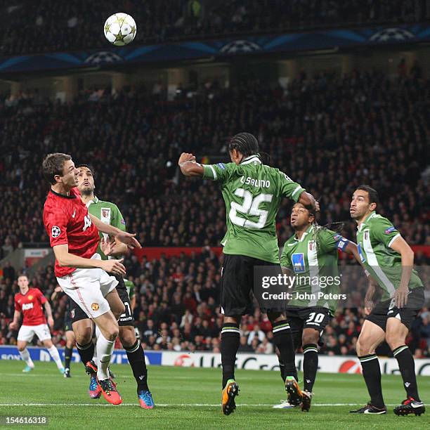 Jonny Evans of Manchester United in action with Leandro Salino of SC Braga during the UEFA Champions League Group H match between Manchester United...