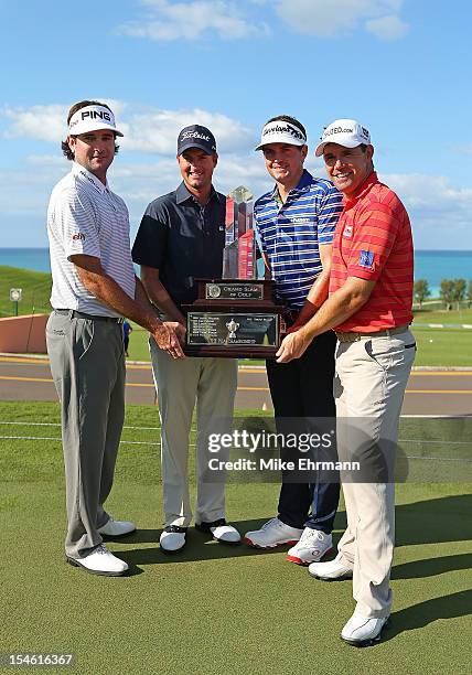 Bubba Watson, Webb Simpson, Keegan Bradley, and Padraig Harrington pose with the Grand Slam Trophy during the PGA Grand Slam of Golf at Port Royal...