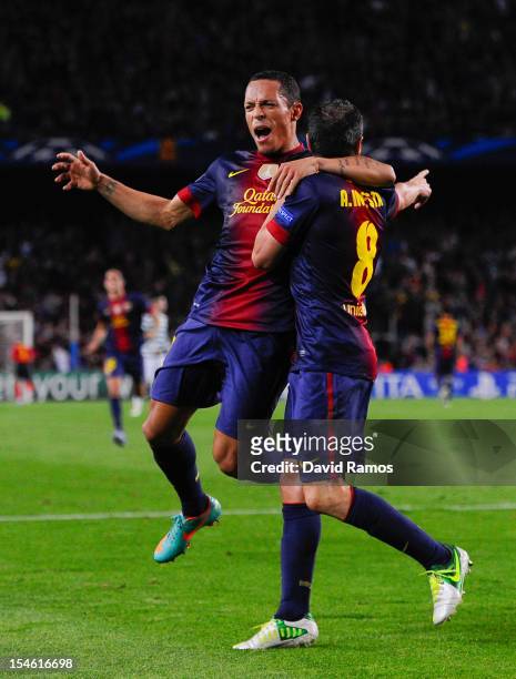 Andres Iniesta of FC Barcelona celebrates with his teammate Adriano Correia after scoring his team's first goal goal during the UEFA Champions League...