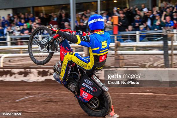 Tobiasz Musielak celebrates with a wheelie during the Sports Insure Premiership match between Sheffield Tigers and Belle Vue Aces at Owlerton...