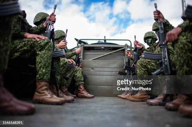 Colombian navy military soldiers sit on a transport truck during the annual parade of the celebration of Colombia's 213 years of independence in...