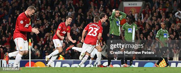Jonny Evans of Manchester United celebrates scoring their second goal during the UEFA Champions League Group H match between Manchester United and SC...