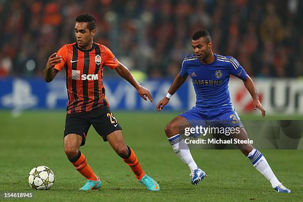 Alex Teixeira of Shakhtar Donetsk is tracked by Ashley Cole of Chelsea during the UEFA Champions League Group E match between Shakhtar Donetsk and...