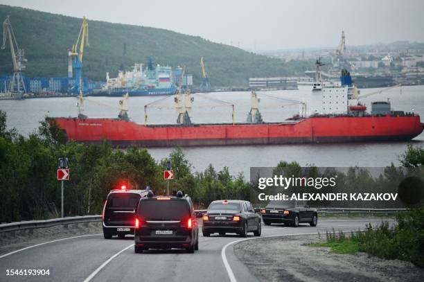 The motorcade of Russian President Vladimir Putin travels in the town of Severomorsk in the Murmansk region on July 20, 2023.