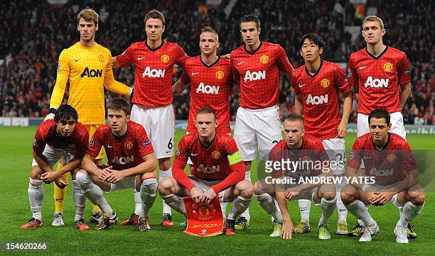The Manchester United team: Manchester United's Spanish goalkeeper David de Gea, Northern Irish defender Jonny Evans, Dutch defender Alexander...
