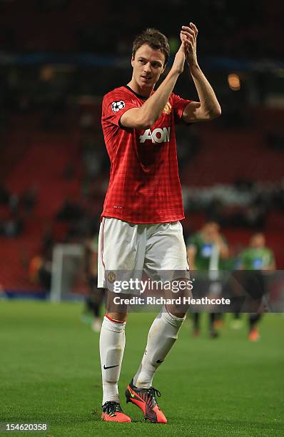 Jonny Evans of Manchester United applauds at the end of the UEFA Champions League Group H match between Manchester United and SC Braga at Old...