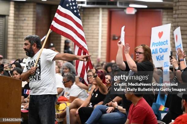 Parental rights supporter Manuk Grigoryan gestures towards supporters as speaks to the Chino Valley Unified School District board at Don Lugo High...