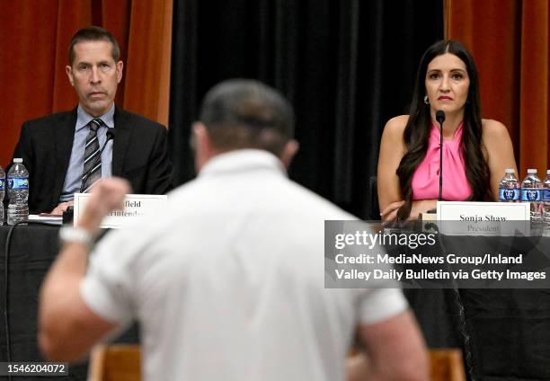 Chino Valley Unified School District Superintendent Dr. Norm Enfield, left, and President Sonja Shaw, right listen to a speaker during a board...