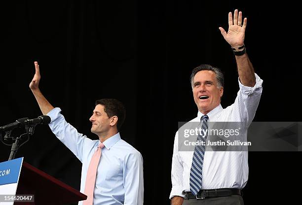 Republican presidential candidate, former Massachusetts Gov. Mitt Romney and his running mate Rep. Paul Ryan wave to supporters during a campaign...