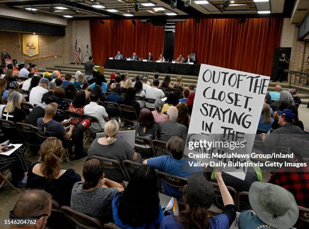 Gay and transgender students rights supporter holds a sign during a board meeting of the Chino Valley Unified School District at Don Lugo High School...