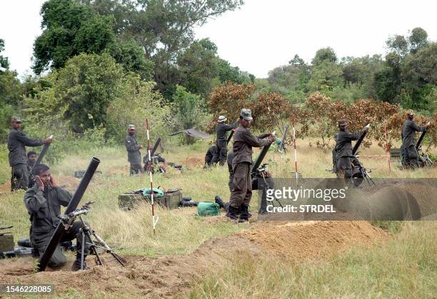 Sri Lanka's elite Special Forces commandos fire shells 21 June 2007 in the eastern jungles of Thoppigala during an operation against Tamil Tiger...