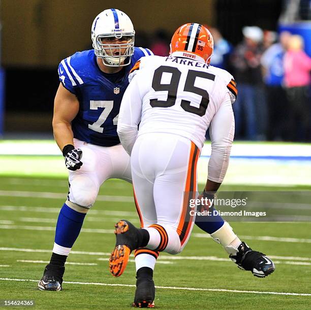 Offensive linemen Anthony Castonzo of the Indianapolis Colts blocks defensive linemen Juqua Parker of the Cleveland Browns during a game with the...