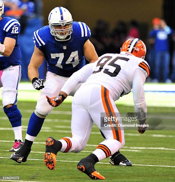 Offensive linemen Anthony Castonzo of the Indianapolis Colts blocks defensive linemen Juqua Parker of the Cleveland Browns during a game with the...