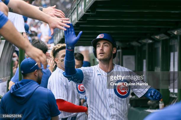 Cody Bellinger of the Chicago Cubs celebrates with teammates after his grand slam home run in the third inning of the game against the Boston Red Sox...