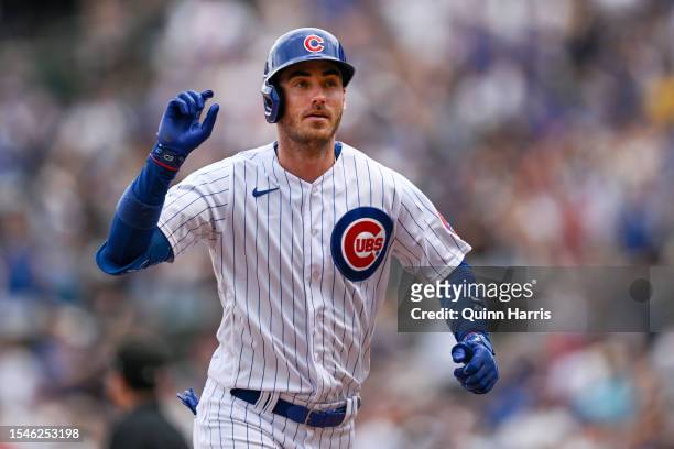 Cody Bellinger of the Chicago Cubs rounds the bases after his grand slam home run in the third inning against of the game the Boston Red Sox at...