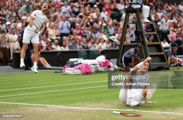 Neal Skupski of Great Britain and Wesley Koolhof of the Netherlands celebrate match point in the Men's Doubles Finals against Marcel Granollers of...