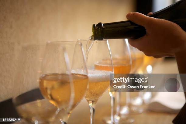 pouring champagne at a wedding reception - campagne france stock pictures, royalty-free photos & images