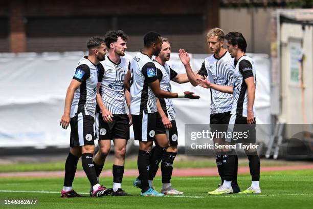 Stephen Wearne of Gateshead FC celebrates with teammates after scoring the second goal during the Pre Season Friendly between Gateshead FC and...