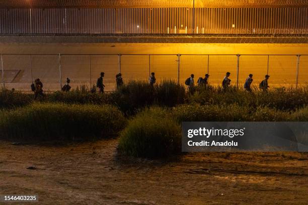 Group of around 60 Venezuelan migrants turn themselves in to the Border Patrol after crossing the Rio Grande in Ciudad Juarez, Mexico on July 20,...